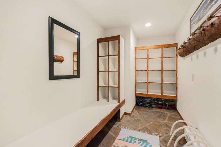 The perfect space for gear, this coat room has ample space for all your fun toys as well as boot warmers to keep your ski boots dry.