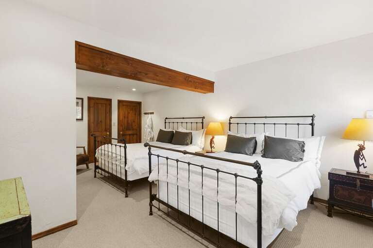 Spacious guest room with 2 queen beds offers plenty of space for guests and family.