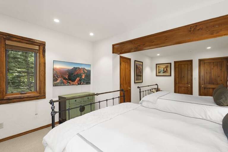 Spacious guest room with 2 queen beds offers plenty of space for guests and family.