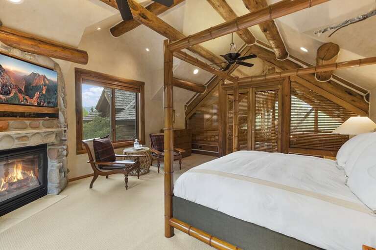 This spacious Primary Suite features a king bed and gas fireplace as well as your own private deck.