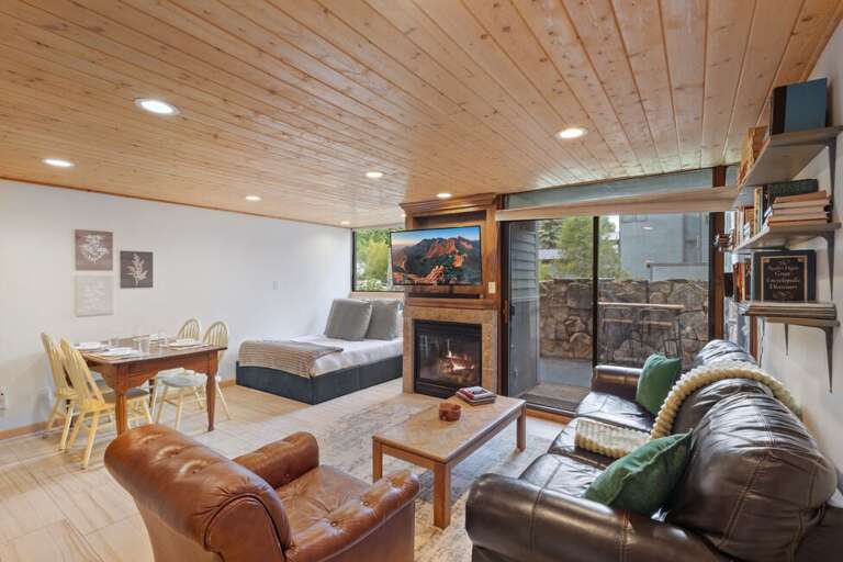 Charming studio with cozy fireplace, private patio, and warm wood accents—perfect for a relaxing mountain escape.