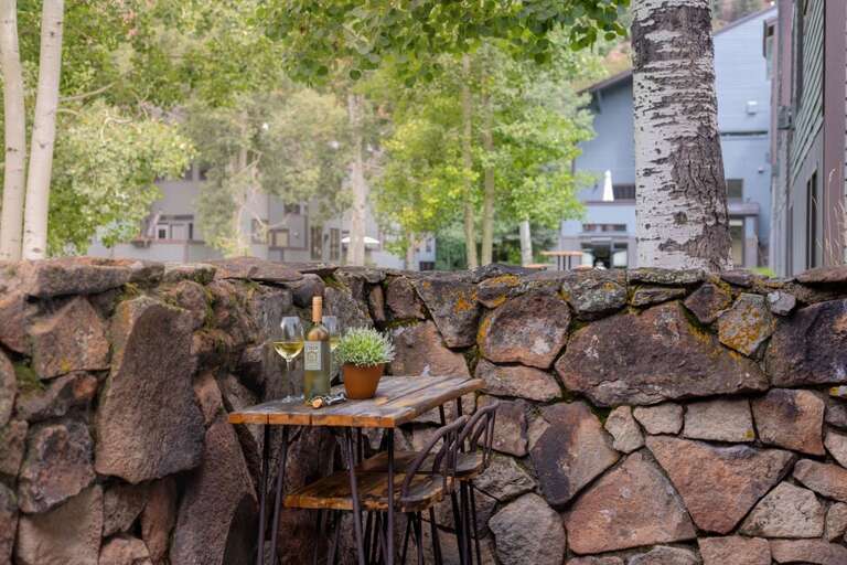 Enjoy the peace of the green space on your private patio.