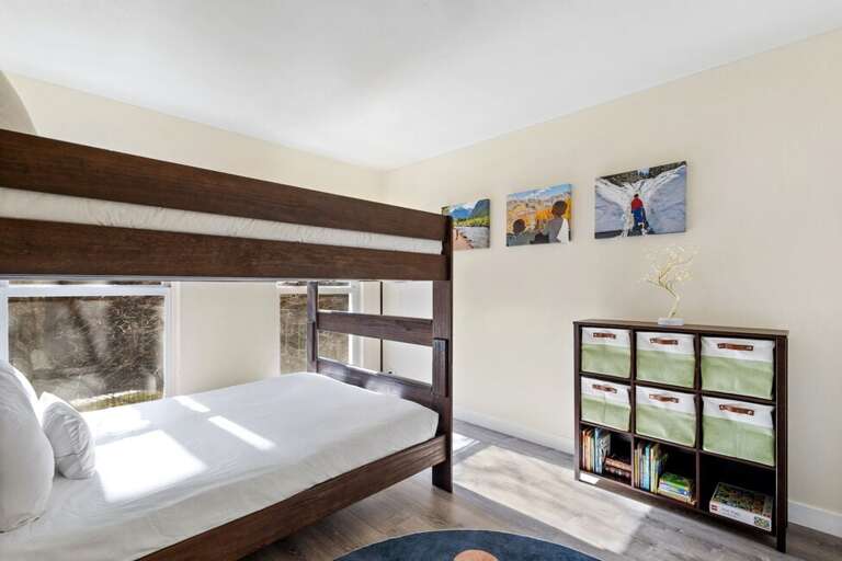 This comfortable guest room offers plenty of storage and a spacious closet to keep your stay organized.