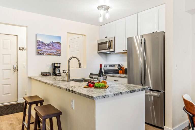 This kitchen has everything you need to entertain guests or cook in and have family time or grab a quick snack between adventures.