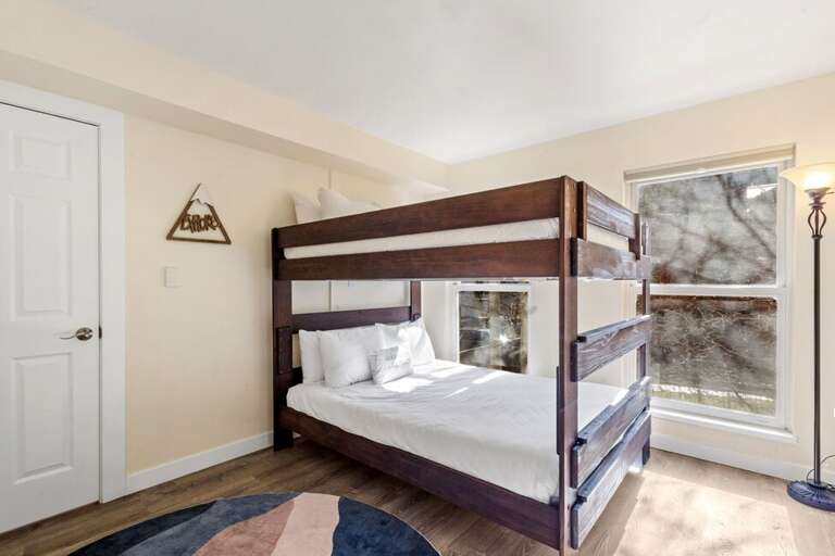 Perfect for families or friends, the second guest room offers queen-over-queen bunk beds — spacious, stylish, and fun for everyone.