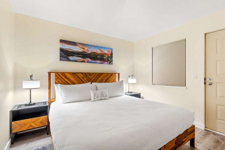 Spacious primary bedroom with a comfortable king bed.