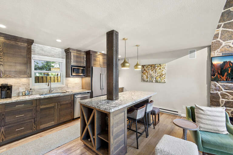 Large spacious kitchen with large island for dining-Modern appliances and plenty of counter space for all your kitchen needs.