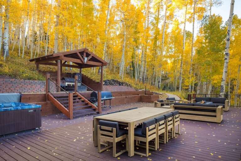 This deck offers outdoor dining, gas grill, private hot tub and relaxed fireside seating.