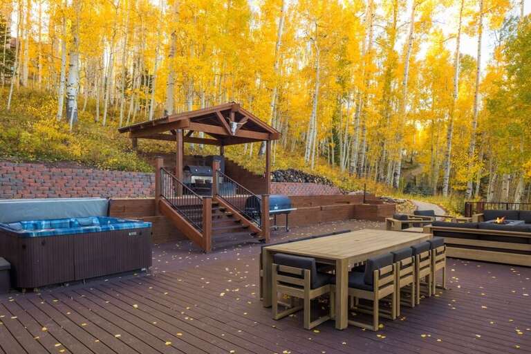 This deck offers outdoor dining, gas grill, private hot tub and relaxed fireside seating.
