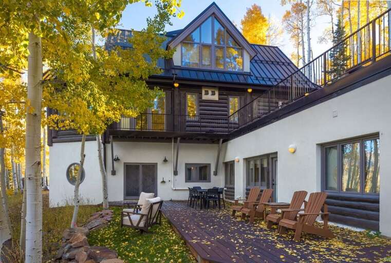 another deck space offers cozy seating as well as outdoor dining area and stunning views.