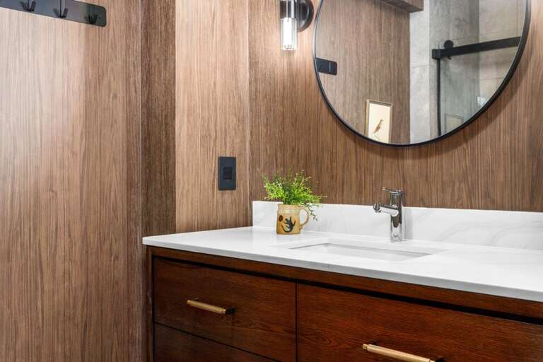 Beautiful bathroom with step in shower and single vanity.