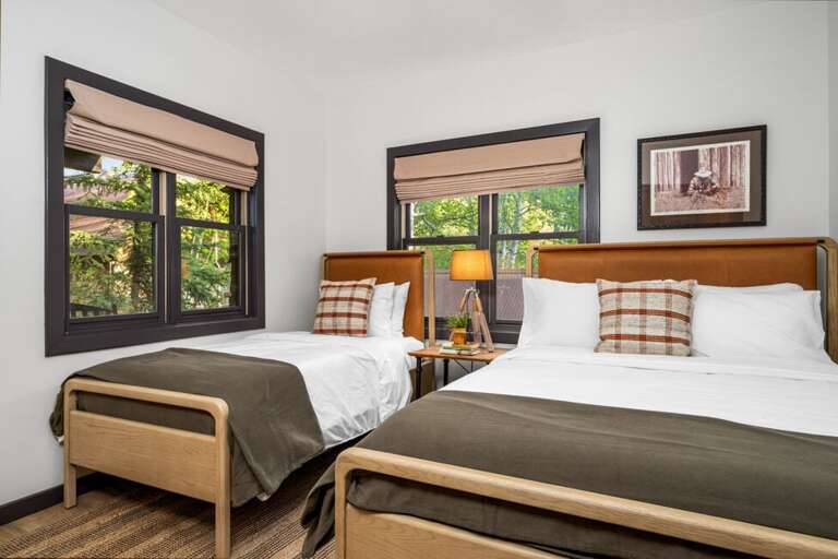 Guest room with Queen bed and single bed for extra guests.