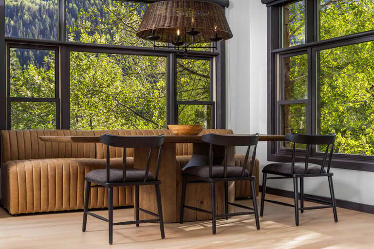 Perfect dining area features banquet and chair seating for 8+.