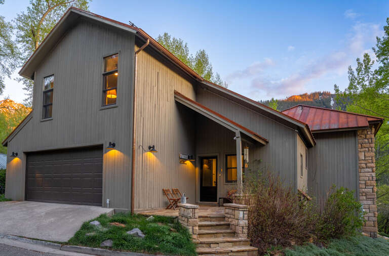 This stunning home is located in a quiet neighborhood and features mountain views and open living.