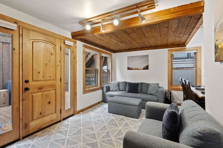 Enter into a comfy living area with open access to the kitchen and dining area.