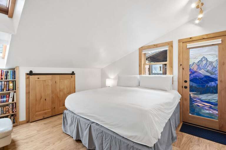 Primary Suite features personal entrance, king bed and ensuite bathroom as well as a cozy reading nook to relax.