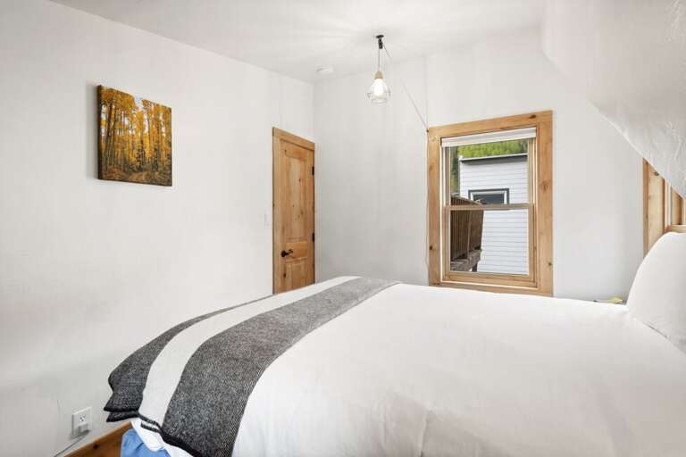 Queen bed guest room.