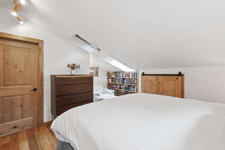 Spacious primary located off living and dining area.