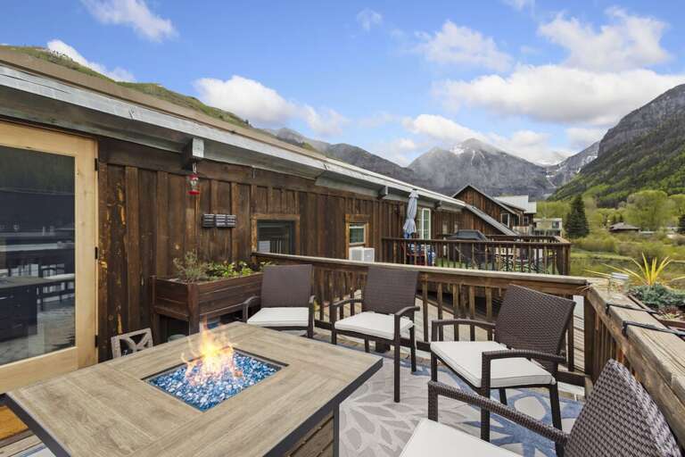 Stunning deck area with gas fireplace overlooking Telluride valley.