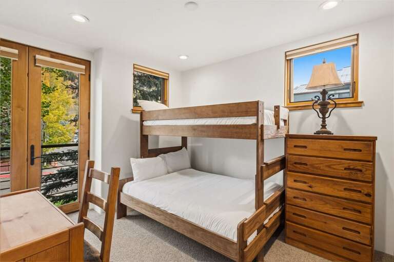 Guest bunk room with twin-over-full bunk beds, perfect for kids or additional guests.