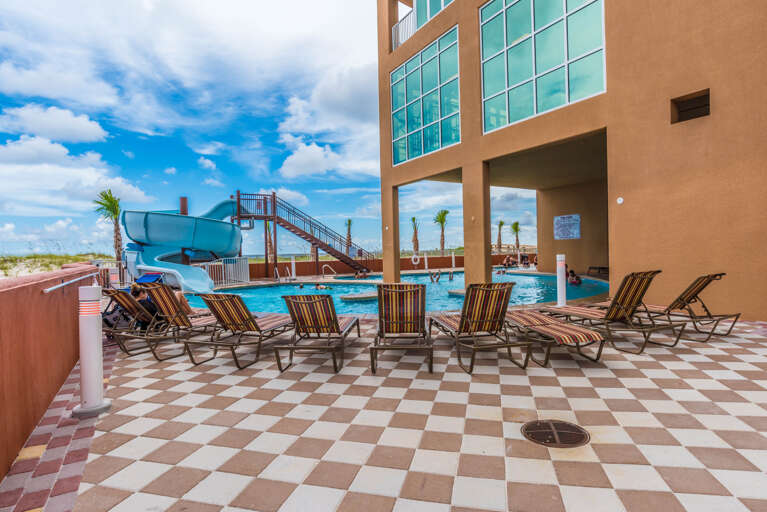 Phoenix Gulf Shores Zero Entry Outdoor Pool with Corkscrew Water Slide Phoenix Gulf Shores Zero Entry Outdoor Pool with Corkscrew Water Slide