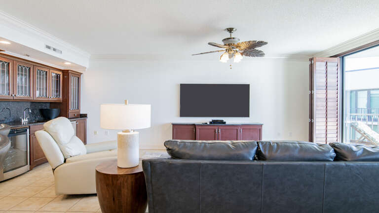 Living Room Interior Of A Vacation Rental With Sofa And Television Living Room Interior Of A Vacation Rental With Sofa And Television