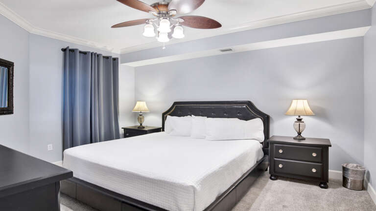 Bedroom Interior With Large Bed And Ceiling Fan Bedroom Interior With Large Bed And Ceiling Fan