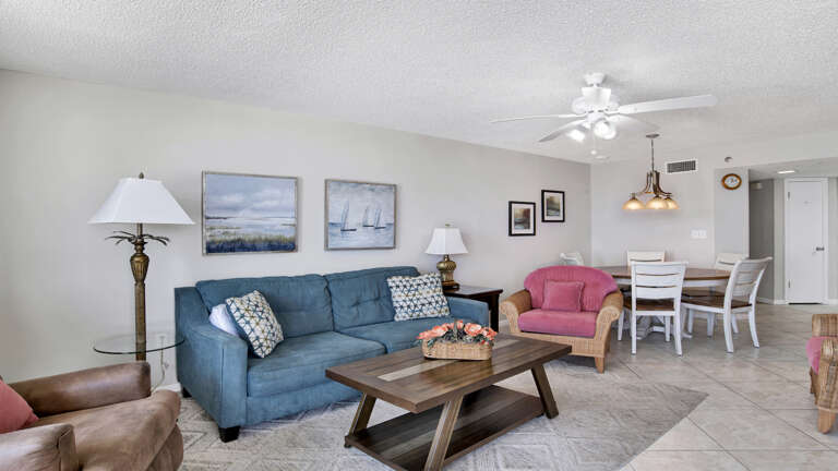 Living Room With Sofas, Coffee Table, And Dining Area Living Room With Sofas, Coffee Table, And Dining Area