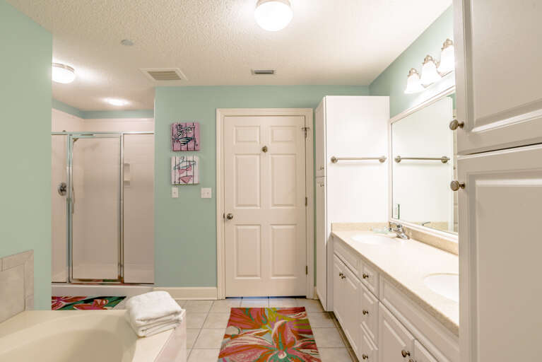 Phoenix West 204 Master Bathroom with his & her sinks, jacuzzi tub, walk in shower with two shower heads, spacious closet large enough to hold a pack in play
