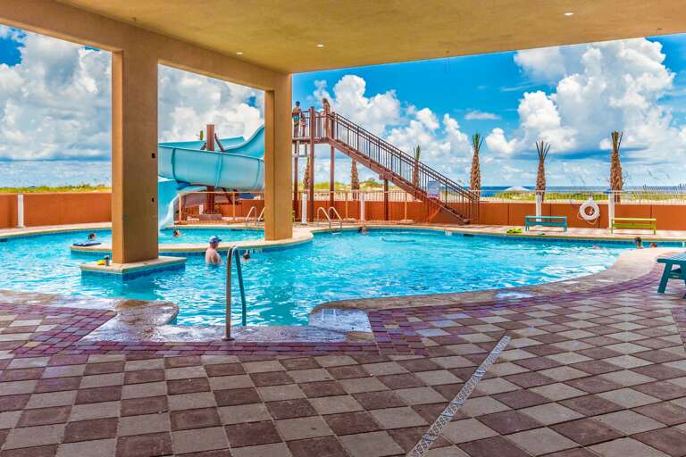 Phoenix Gulf Shores Exterior Zero Entry Pool with Corkscrew Waterslide