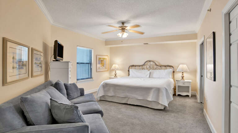 Interior With Bed, Sofa, And Ceiling Fan