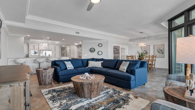 Spacious Living Room With Blue Sofas And Open Floor Plan