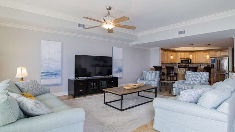 Living Room Interior With Sofas And TV, Open Concept Kitchen In Background Living Room Interior With Sofas And TV, Open Concept Kitchen In Background