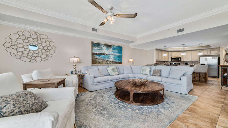 Interior Of A Living Room With Furniture And Open Kitchen In The Background