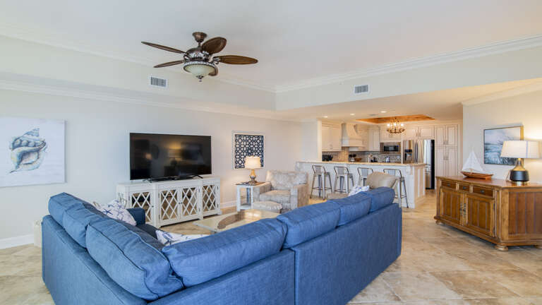Spacious Living Room Leading To Kitchen Area In A Vacation Rental