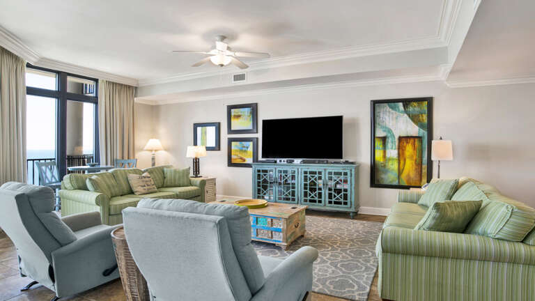 Interior Of A Vacation Rental Living Room With TV And Sea View