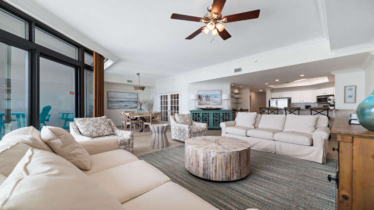 Spacious Living Area In A Vacation Rental With Sofas And Dining Space