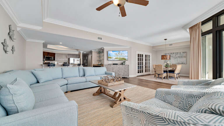 Interior Of A Living Room In A Vacation Rental With Blue Sofas And Open Floor Plan Interior Of A Living Room In A Vacation Rental With Blue Sofas And Open Floor Plan