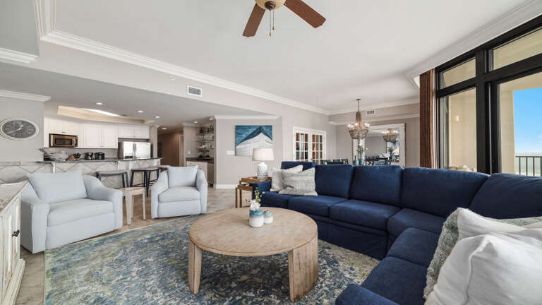 Interior Living Space With Blue Sofa And Ocean View