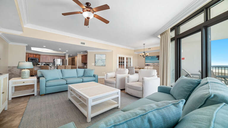 Spacious Seating With Sofas, Ceiling Fan, And Sea View