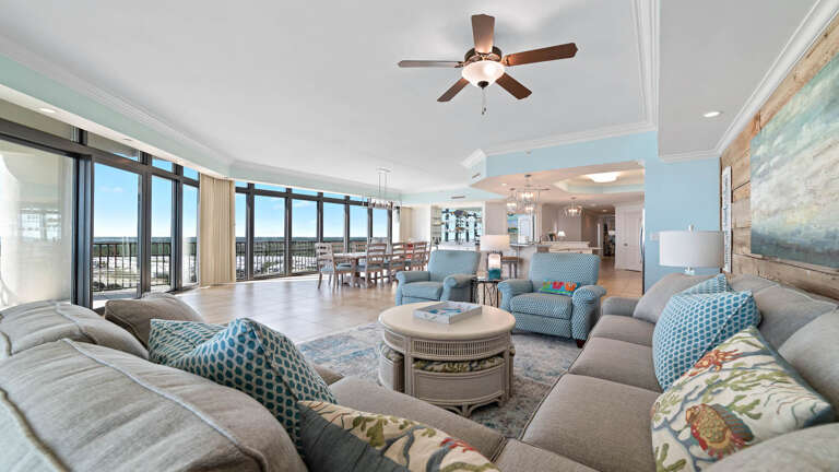 Interior Of A Living Room With Sectional Sofa And Ocean View