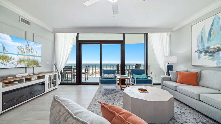 Beach View Living Space With Large Windows And Light Decor, Leading To Balcony