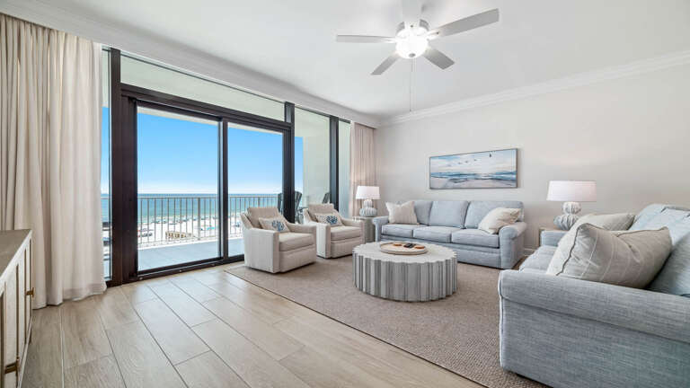 Seaside Living Space With Sweeping Shore Views, Featuring Plush Pale Furnishings And Luminous, Large Windows