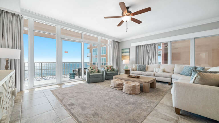Seaside Space Showcasing Subtle Shades, Spacious Seating, Sandy Shores Seen Through Sliding Glass Doors
