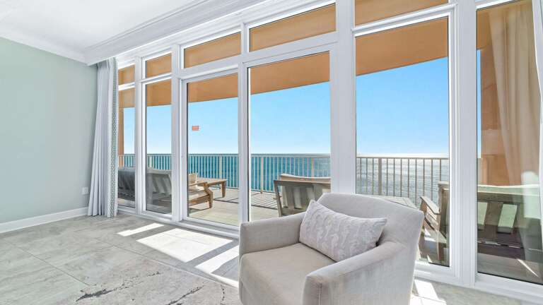 Room With Wide Windows Showing Serene Sea, Simple Sofa Set Inside