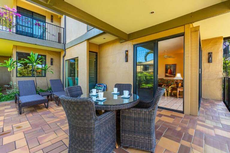 Patio Perspective Of A Peaceful Vacation Rental With Sliding Doors And Garden View