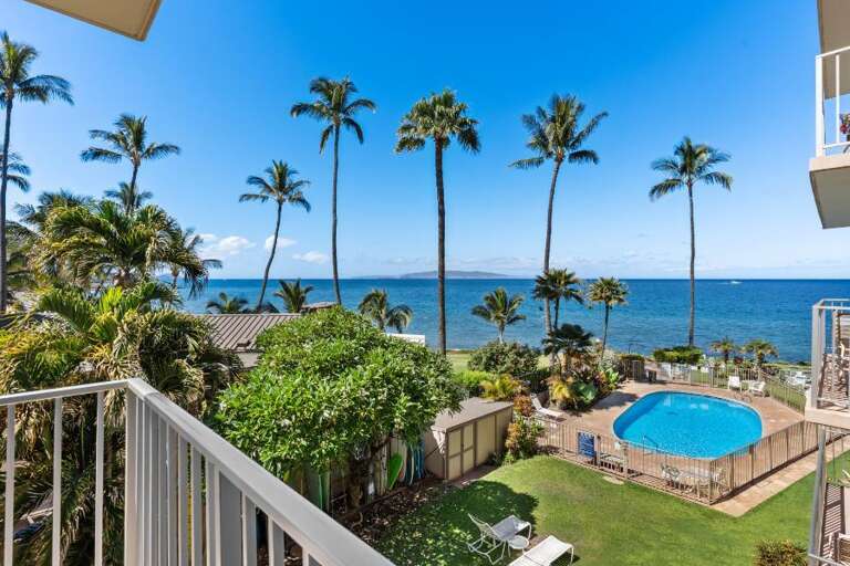 Balcony View Of Blue Pool By Breezy Palms, Seaside Scene