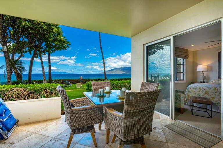 Seaside Vacation Rental View With Patio Seating Facing The Ocean