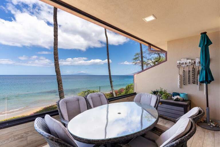 Seaside Vacation Rental Balcony With Dining Set Overlooking Beach