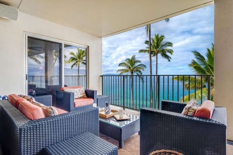 Balcony View With Blue Sea, Sky, And Swaying Palms